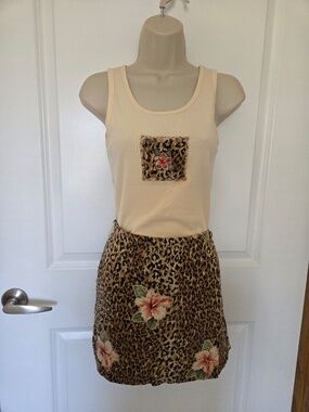 2 Piece skort and tank top, top is PM and bottom is PS. Skort is roomy.